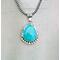 Front hanging view large blue turquoise pear cabochon bezel set accented with beads and stamped wire on oxidized navajo pearls 